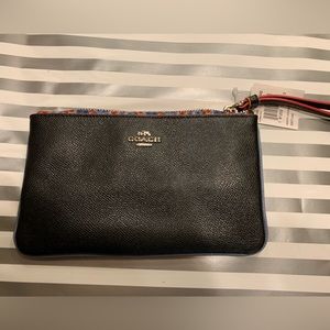 New with tags Coach Black leather wristlet.